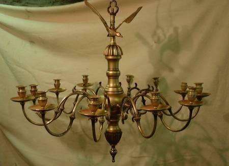 18th Century brass chandelier This is how the chandelier looked after the wooden repairs were gilded, it hung high up in the church which made regular cleaning impossible, so we lacquered the brass which preserved the colour match between the original pie